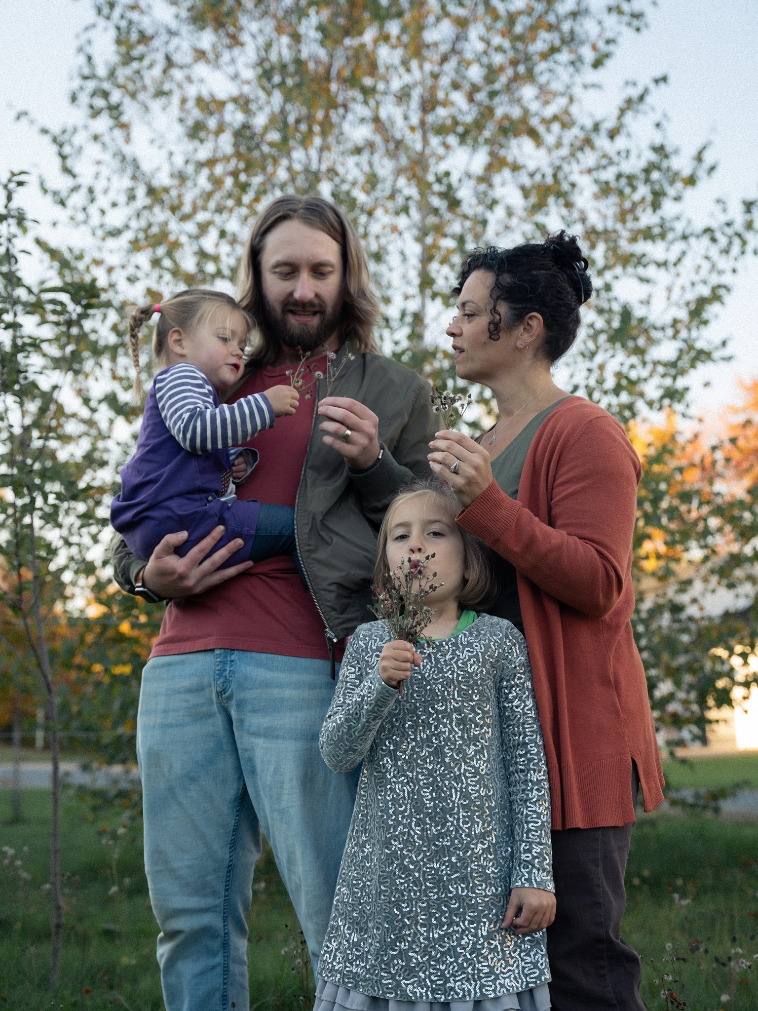 A family discovering wildflowers together